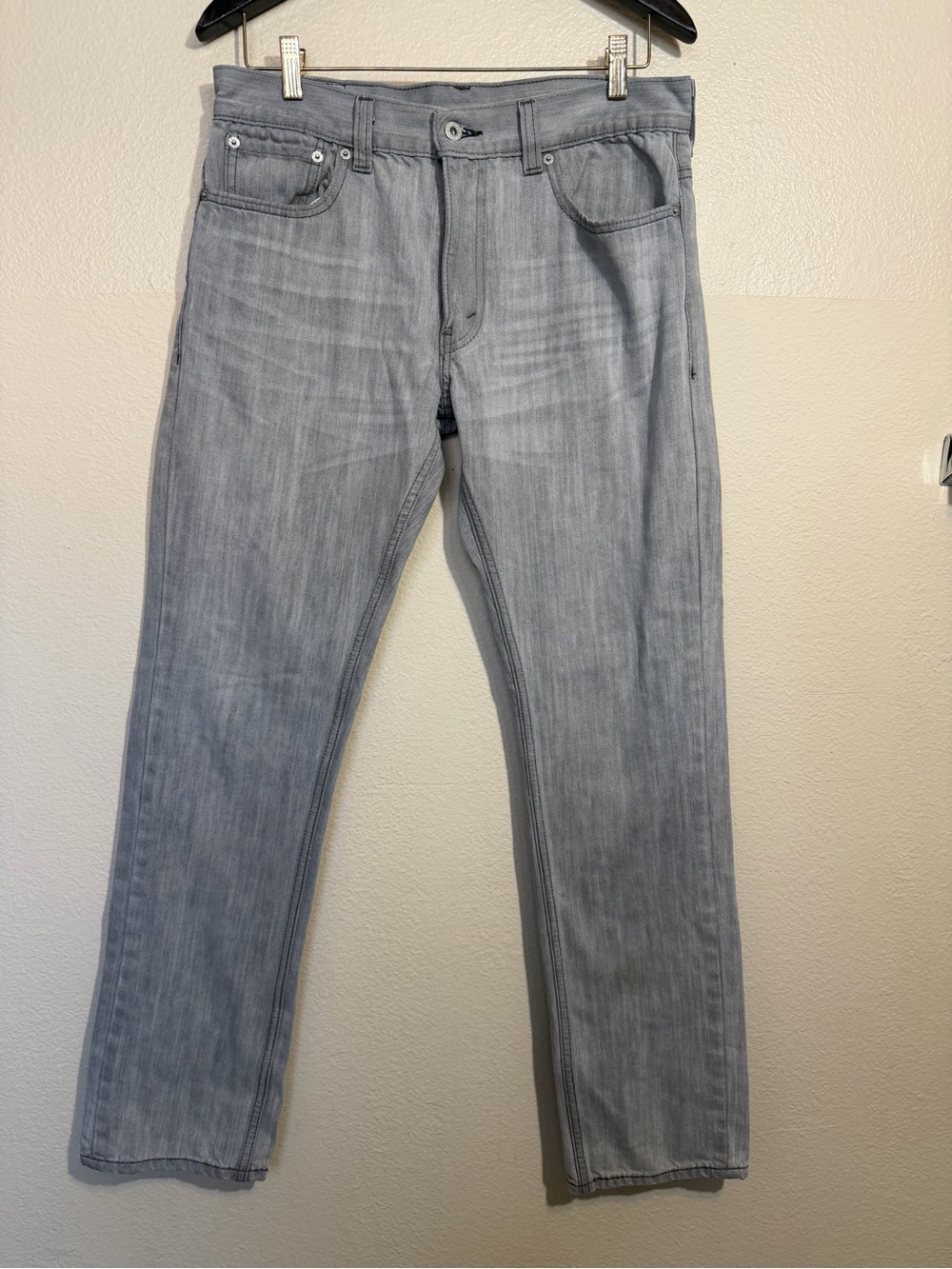Levi's 511 Slim Fit jeans in a faded light grey wash.